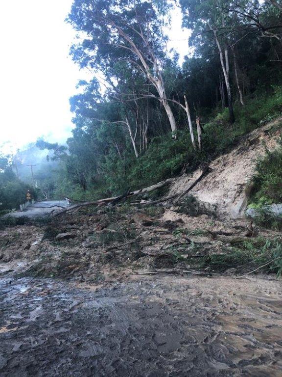 road with landslip of mud and debris on road 