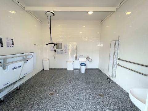 public custom build accessible adult change facility with privacy screen, toilet, hoist, sink 