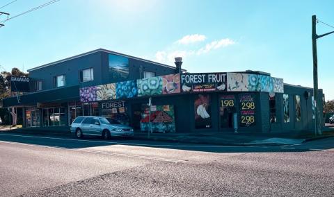 grocery shopfront on corner block with new signage 