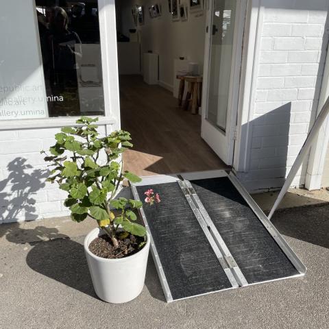 portable ramp to shop front of a gallery