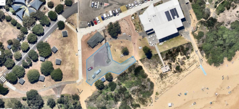 aerial of site with beach and buildings 