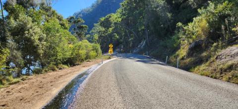 Wisemans Ferry Road road with resurfacing in rural riverside area