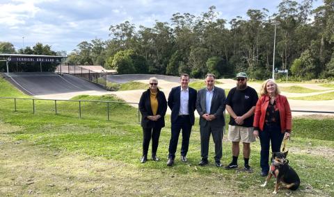 Councillor Sharon Walsh, Dr Gordon Reid MP, Mayor Lawrie McKinna, Terrigal BMX Club Grants and Council Coordinator, Luke Birch, Councillor Belinda Neal and Cervantes the dog at Terrigal BMX Track