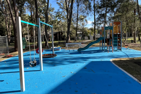 Kingfisher playspace Kingfisher playspace with play equipment, swing set and blue softfall